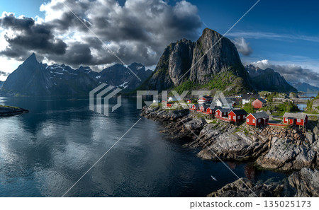 Picturesque Coastal Village Hamnoy With Red Rorbuer Huts On Lofoten Islands In Norway 135025173