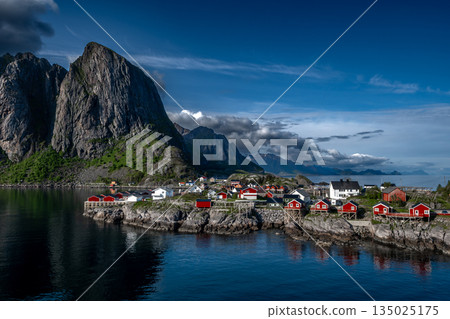 Picturesque Coastal Village Hamnoy With Red Rorbuer Huts On Lofoten Islands In Norway Picturesque Coastal Village Hamnoy With Red Rorbuer Huts On Lofoten Islands In Norway 135025175