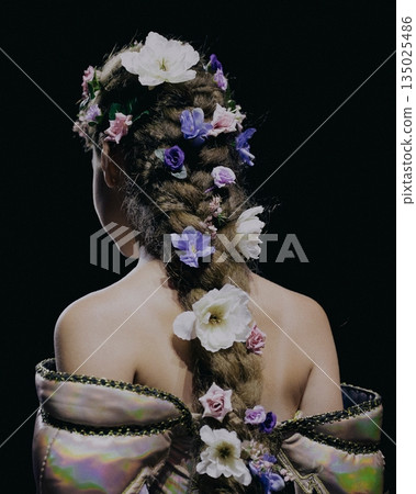 braided hair decorated with flowers, silk robe draped over shoulders, long braid woven with roses and violets, dark studio backdrop, soft rim lighting braided hair decorated with flowers, silk robe draped over shoulders, long braid woven with roses and violets, dark studio backdrop, soft rim lighting 135025486
