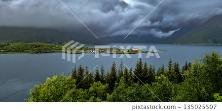 Rural Landscape With Remote Village, Calm Fjord And Foggy Mountains On Lofoten Islands In Norway 135025507