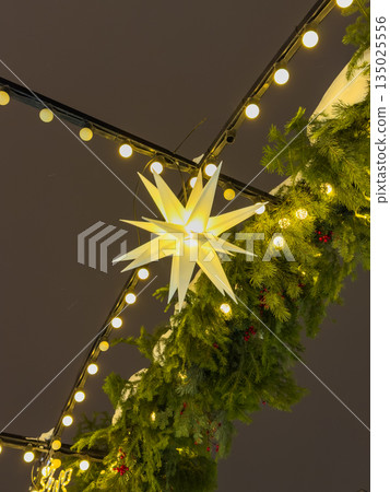 Vibrant evening market illuminated with bright decorations and pine scent 135025556