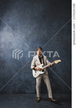 Senior men playing the guitar 135026106