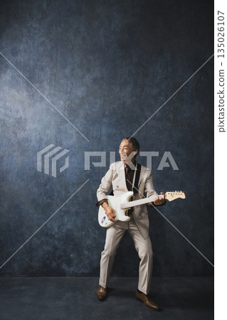 Senior men playing the guitar 135026107