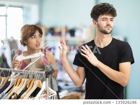 Young couple quarrel while shopping in store Young couple quarrel while shopping in store 135026286
