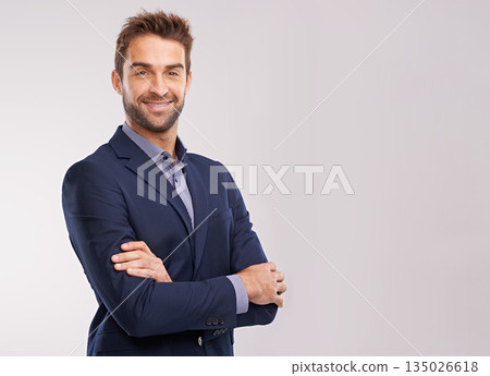 Portrait of confident business man, arms crossed in a suit with smile isolated on studio background. Professional mindset, career success and mockup space with corporate male employee and pride 135026618