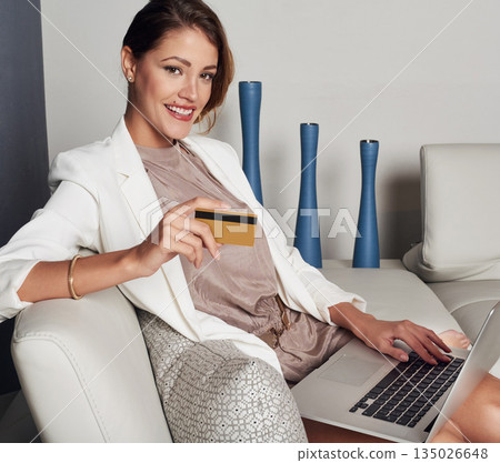 Portrait, credit card and woman on laptop, sofa and online shopping, ecommerce and fintech at home. Relax, rich and happy person for internet banking, holiday gift and computer or app digital payment Portrait, credit card and woman on laptop, sofa and online shopping, ecommerce and fintech at home. Relax, rich and happy person for internet banking, holiday gift and computer or app digital payment 135026648