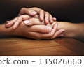 Closeup, love and holding hands for support, comfort and care with grief, loss and empathy. Zoom, people and friends with compassion, sympathy and healing with bonding, hope and trust with crisis 135026660