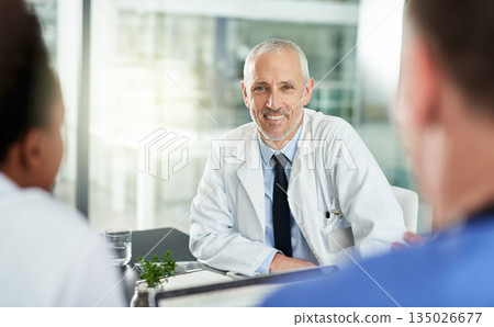 Portrait, man and doctor with team in office for meeting, clinic collaboration and leadership of medical partnership. Happy healthcare worker, manager and expert consulting with employees in hospital Portrait, man and doctor with team in office for meeting, clinic collaboration and leadership of medical partnership. Happy healthcare worker, manager and expert consulting with employees in hospital 135026677
