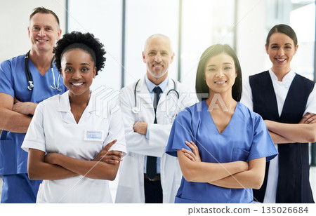 Confidence, crossed arms and portrait of team of doctors standing in the hallway with collaboration. Happy, diversity and group of healthcare workers in the corridor of a medical clinic or hospital. Confidence, crossed arms and portrait of team of doctors standing in the hallway with collaboration. Happy, diversity and group of healthcare workers in the corridor of a medical clinic or hospital. 135026684
