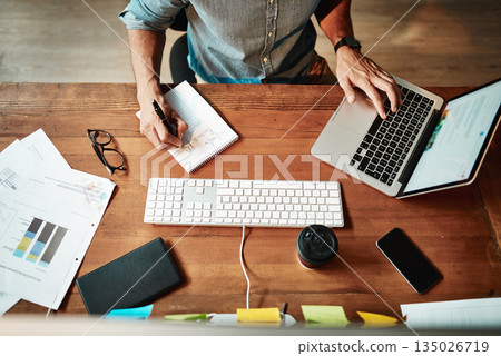 Top view, laptop and business man writing notes for planning, strategy and online data analysis at office desk. Worker, computer and notebook for trading, research and productivity in startup agency Top view, laptop and business man writing notes for planning, strategy and online data analysis at office desk. Worker, computer and notebook for trading, research and productivity in startup agency 135026719