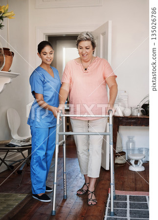 Nurse, woman with disability and walking frame for homecare support, healthcare helping or muscle rehabilitation. Caregiver, mature patient or people for Parkinson, arthritis or home nursing help Nurse, woman with disability and walking frame for homecare support, healthcare helping or muscle rehabilitation. Caregiver, mature patient or people for Parkinson, arthritis or home nursing help 135026786
