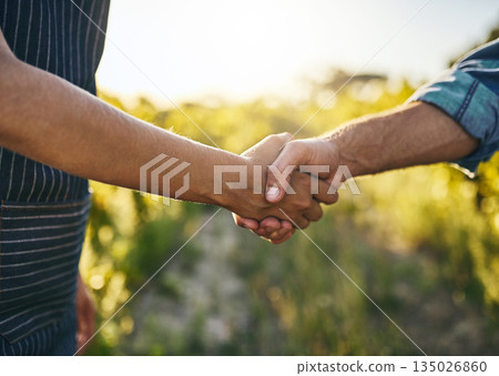 Farmer teamwork, handshake and success for sustainability deal in the countryside on farm. Agriculture, thank you and collaboration agreement in nature with farming worker and sustainable business Farmer teamwork, handshake and success for sustainability deal in the countryside on farm. Agriculture, thank you and collaboration agreement in nature with farming worker and sustainable business 135026860