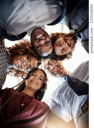Business people, happy group and portrait in a huddle for teamwork, collaboration or team building. Face of diversity men and women together for support, solidarity and trust or motivation from below Business people, happy group and portrait in a huddle for teamwork, collaboration or team building. Face of diversity men and women together for support, solidarity and trust or motivation from below 135026884
