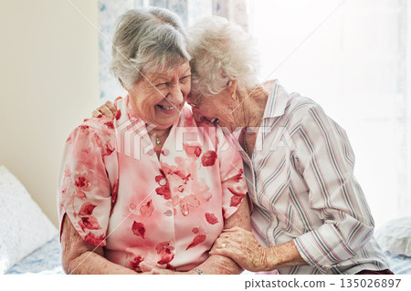 Happy, funny and senior woman friends laughing in the bedroom of a retirement home together. Smile, comedy and laughter with an elderly female pensioner and friend bonding indoor during a visit Happy, funny and senior woman friends laughing in the bedroom of a retirement home together. Smile, comedy and laughter with an elderly female pensioner and friend bonding indoor during a visit 135026897