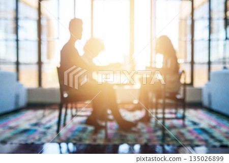 Silhouette, people in business meeting and lens flare or sunlight in modern office planning. Teamwork or collaboration, support and colleagues talking or discussing together at desk in workplace Silhouette, people in business meeting and lens flare or sunlight in modern office planning. Teamwork or collaboration, support and colleagues talking or discussing together at desk in workplace 135026899
