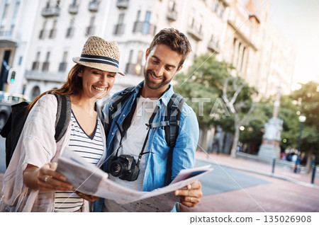 Couple, tourist and a map in a city for travel on a street for direction or location search. Man and woman together with paper for navigation outdoor on urban road for adventure, journey or vacation Couple, tourist and a map in a city for travel on a street for direction or location search. Man and woman together with paper for navigation outdoor on urban road for adventure, journey or vacation 135026908