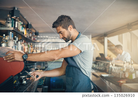 Man in cafe, coffee machine and barista, prepare caffeine drink order with process and production in hospitality industry. Service, male waiter working on espresso or latter beverage in restaurant Man in cafe, coffee machine and barista, prepare caffeine drink order with process and production in hospitality industry. Service, male waiter working on espresso or latter beverage in restaurant 135026910