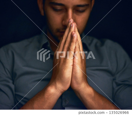 God, worship and man with hands praying for hope, guidance or spiritual healing in a dark studio. Pray, thank you and Christian man in prayer for help, faith or gratitude and praise to Jesus christ God, worship and man with hands praying for hope, guidance or spiritual healing in a dark studio. Pray, thank you and Christian man in prayer for help, faith or gratitude and praise to Jesus christ 135026966