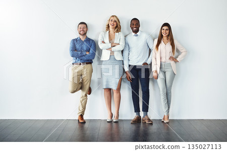 Portrait, diversity and collaboration with business people in studio together against a gray wall for mockup. Teamwork, confidence or professional with a group of colleagues in the office for success Portrait, diversity and collaboration with business people in studio together against a gray wall for mockup. Teamwork, confidence or professional with a group of colleagues in the office for success 135027113