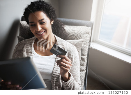 Ecommerce, credit card and girl on tablet for online shopping, product or digital payment in home or internet banking. Latino woman, debit order and technology, retail or spending money in house Ecommerce, credit card and girl on tablet for online shopping, product or digital payment in home or internet banking. Latino woman, debit order and technology, retail or spending money in house 135027130