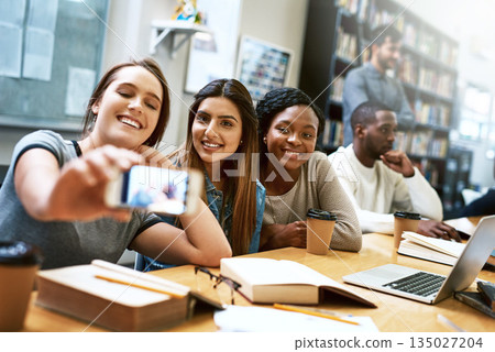 Women friends, selfie and college library with smile, happiness or diversity for social media app. Girl, group and happy for photography, profile picture or blog for solidarity, education or support Women friends, selfie and college library with smile, happiness or diversity for social media app. Girl, group and happy for photography, profile picture or blog for solidarity, education or support 135027204