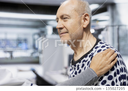 Female lab scientist reassuring senior person during drug testing procedure, making progress in healthcare and medicine. Nurse consoling and encouraging man during laboratory study. 135027205