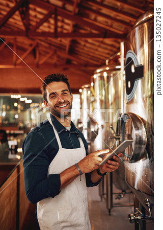 Tablet, beer and portrait with man in factory for production, manufacturing and alcohol fermentation. Technology, inspection and digital with business owner for distillery, storage or quality control 135027245