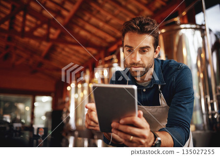 Tablet, focus and brewery with man in factory for production, manufacturing and alcohol fermentation. Technology, inspection and digital with business owner for distillery, storage or quality control Tablet, focus and brewery with man in factory for production, manufacturing and alcohol fermentation. Technology, inspection and digital with business owner for distillery, storage or quality control 135027255
