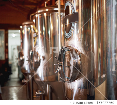 Big fermentation tanks, beer and factory with industry, container and industrial machine. Brewery, alcohol and manufacturing with steel, metal and system with labor, shine, product and machinery Big fermentation tanks, beer and factory with industry, container and industrial machine. Brewery, alcohol and manufacturing with steel, metal and system with labor, shine, product and machinery 135027260