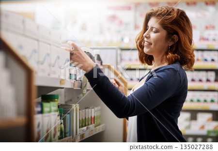 Happy woman, shopping and pharmacy for pills, medication or drugs for healthcare on shelf at store. Female person, customer or patient checking pharmaceutical products, medicine or stock at clinic Happy woman, shopping and pharmacy for pills, medication or drugs for healthcare on shelf at store. Female person, customer or patient checking pharmaceutical products, medicine or stock at clinic 135027288
