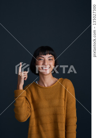Woman in portrait, pointing up with advertising and mockup space, smile and promo isolated on dark background. Happy female person, ambassador and branding with marketing and presentation in studio Woman in portrait, pointing up with advertising and mockup space, smile and promo isolated on dark background. Happy female person, ambassador and branding with marketing and presentation in studio 135027300