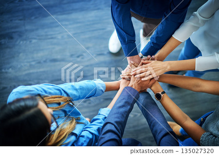 Top view, business and group with hands together, support and collaboration with teamwork, partnership and goals. Staff, team and coworkers with brainstorming, target and innovation with cooperation Top view, business and group with hands together, support and collaboration with teamwork, partnership and goals. Staff, team and coworkers with brainstorming, target and innovation with cooperation 135027320