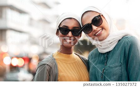 Women friends, hijab and portrait in city with smile, sunglasses and support on street in Qatar. Islamic woman, together and freedom in metro with fashion, happy face and solidarity on travel 135027372
