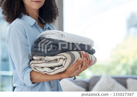Clean laundry, holding and hands with towels from the wash for the house and fresh linen. Cleaner, organize and a woman with clothes in an apartment, packing and organizing clothing for routine Clean laundry, holding and hands with towels from the wash for the house and fresh linen. Cleaner, organize and a woman with clothes in an apartment, packing and organizing clothing for routine 135027387