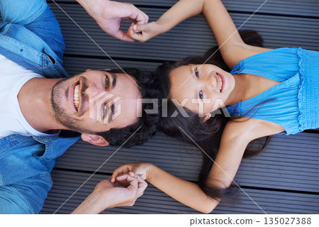 Holding hands, floor portrait and relax happy family, children and dad smile for Fathers day, outdoor peace and connection. Solidarity, closeup and young kid, girl or youth child bonding with parent Holding hands, floor portrait and relax happy family, children and dad smile for Fathers day, outdoor peace and connection. Solidarity, closeup and young kid, girl or youth child bonding with parent 135027388