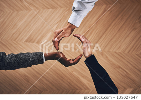 Teamwork, collaboration or hands of business people in circle for motivation, support or recycling in office. Diversity, recycle or top view of employees for goals, community or corporate partnership Teamwork, collaboration or hands of business people in circle for motivation, support or recycling in office. Diversity, recycle or top view of employees for goals, community or corporate partnership 135027647