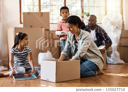 Family, moving and packing boxes into home living room together with children, mom and dad. Property, real estate investment and house move with couple, kids helping box and cardboard unpacking Family, moving and packing boxes into home living room together with children, mom and dad. Property, real estate investment and house move with couple, kids helping box and cardboard unpacking 135027718