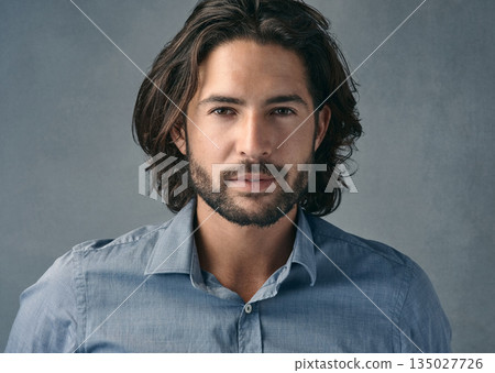 Portrait, confident and business man with long hair, beard on gray studio background. Face, businessman and model with professional focus of entrepreneur, manager or casual corporate worker Portrait, confident and business man with long hair, beard on gray studio background. Face, businessman and model with professional focus of entrepreneur, manager or casual corporate worker 135027726