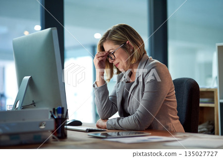 Headache, stress and business woman in office, tired or fatigue while working late at night on computer. Burnout, deadline and female worker with depression, anxiety or brain fog, sick or exhausted. 135027727