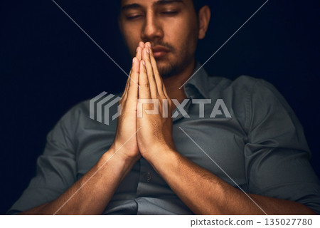 Pray, worship and man with praying hands in studio for hope, faith and religious guidance. Palms, prayer and male person with gesture for faith, God and gratitude to Jesus for help, trust and belief 135027780