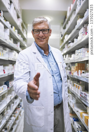 Senior man, pharmacist and handshake for introduction or greeting at a healthcare pharmacy. Portrait of happy elderly male person or medical expert shaking hands in pharmaceutical for health advice Senior man, pharmacist and handshake for introduction or greeting at a healthcare pharmacy. Portrait of happy elderly male person or medical expert shaking hands in pharmaceutical for health advice 135027835