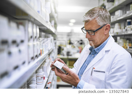 Pharmacy, medicine and check with man at shelf in drug store for label, inspection and inventory. Medical, healthcare and pills with male pharmacist in clinic for expert, wellness and product check Pharmacy, medicine and check with man at shelf in drug store for label, inspection and inventory. Medical, healthcare and pills with male pharmacist in clinic for expert, wellness and product check 135027843