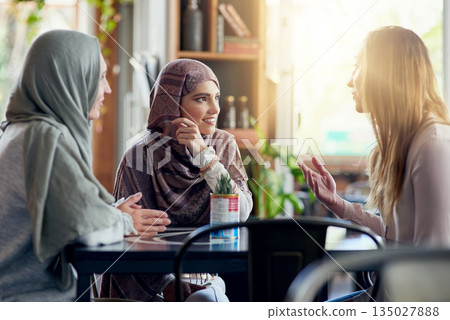 Friends, smile and Muslim women in cafe, bonding and talking together. Coffee shop, happy and Islamic girls, group or people in conversation, chat and discussion for social gathering in restaurant. Friends, smile and Muslim women in cafe, bonding and talking together. Coffee shop, happy and Islamic girls, group or people in conversation, chat and discussion for social gathering in restaurant. 135027888