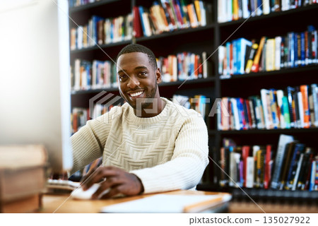 Portrait, education and black man in a library, computer or research for a project, assignment or search website for information. Face, male person or student with technology, knowledge or connection Portrait, education and black man in a library, computer or research for a project, assignment or search website for information. Face, male person or student with technology, knowledge or connection 135027922