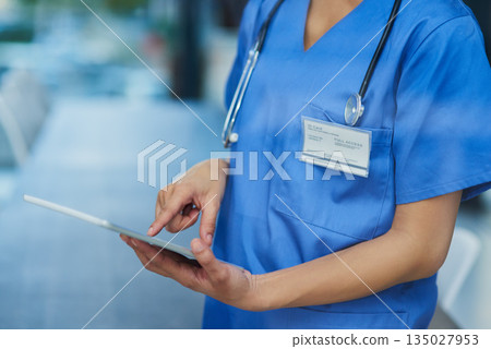 Nurse, hands and tablet, woman check digital healthcare information and technology. Female person in medicine, scroll and review health chart for diagnosis or schedule with medical staff in hospital Nurse, hands and tablet, woman check digital healthcare information and technology. Female person in medicine, scroll and review health chart for diagnosis or schedule with medical staff in hospital 135027953