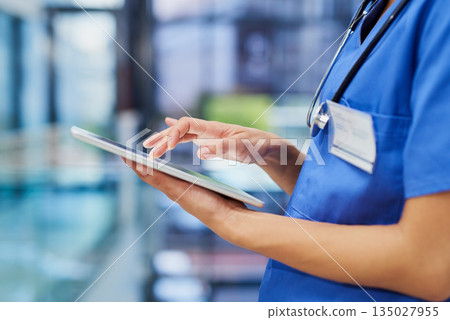 Nurse, hands and tablet, woman scroll through digital healthcare information and technology. Female person in medicine, review health chart for diagnosis or schedule with medical staff in hospital Nurse, hands and tablet, woman scroll through digital healthcare information and technology. Female person in medicine, review health chart for diagnosis or schedule with medical staff in hospital 135027955