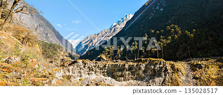 The Himalayan mountain landscape on the trekking route from Khotey to Thuli Kharka on Mera Peak trek in Nepal. 135028517