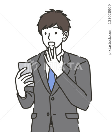 A businessman surprised to see a smartphone A businessman surprised to see a smartphone 135028909