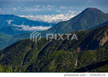 Mount Tateshina and the remaining snow on the Hakuba mountain range seen from Akaiwanoto in the Yatsugatake mountain range Mount Tateshina and the remaining snow on the Hakuba mountain range seen from Akaiwanoto in the Yatsugatake mountain range 135029133