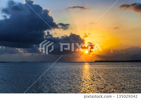 Beautiful sunrise in San Blas Island at politically autonomous Guna territory in Panama. Beautiful sunrise in San Blas Island at politically autonomous Guna territory in Panama. 135029342